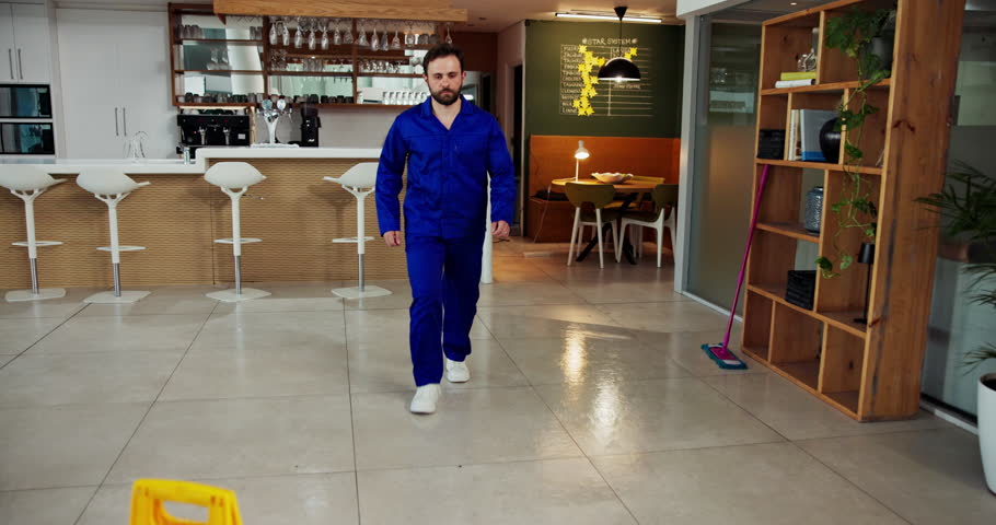 Janitor, accident and man fall in office with workplace safety, ignore warning sign and negligence. Danger, hazard and cleaner slipping on wet floor for workers compensation, mistake and legal claim