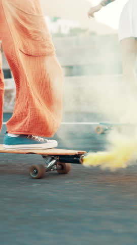 Shoes, skateboard and flare with smoke on road in city with speed, extreme sports and friends in summer. People, sneakers and skater with streetwear, fast and balance for adventure in urban town