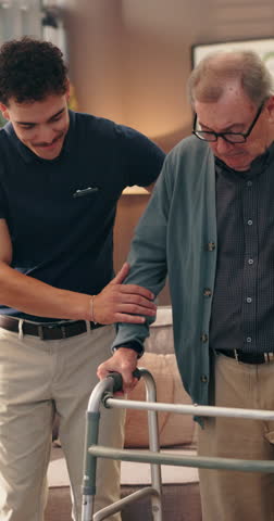 Caregiver, old man and walker with help in home, support or assistance for mobility, recovery or rehabilitation. Healthcare worker, senior patient and guide for walking, balance and elderly care