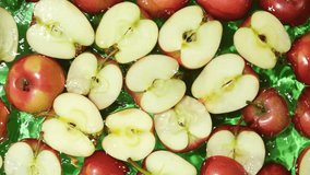 Juicy Whole and Cut Red Apples Close-Up in Water Splash Top View - Powered by Shutterstock - Get 15% off with code: PIKWIZARD15
