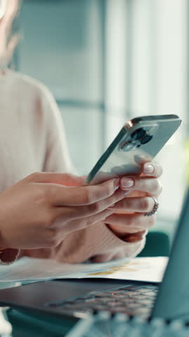 Hands, laptop and phone with student in home for distance learning, education or remote study. Communication, computer and text message with college or university learner in apartment for scholarship