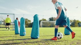 Boys, dribble and ball for soccer practice with defence, team training and fitness exercise. Children, equipment and drill with net for sports workout, skills technique and agility for match session - Powered by Shutterstock - Get 15% off with code: PIKWIZARD15