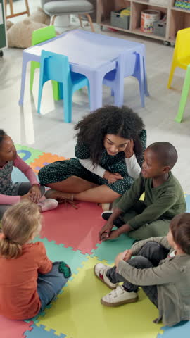 Sing, classroom and teacher with children on floor for music lesson, education and learning. School, happy students and kids with educator for creative activity, language development and knowledge