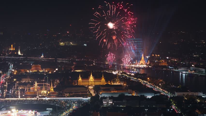 Colorful fireworks light up the night sky over bangkok, thailand, illuminating the cityscape, Aerial view