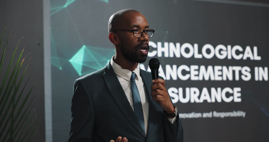 Presenter, black man and speech at conference event for technological advancements in insurance. Public speaking, presentation and live summit, automation pitch and claims process for fraud detection