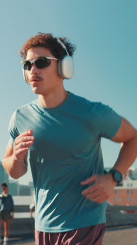 Running, music and man check smart watch in city for tracking performance, health info and time. Workout, wristwatch and athlete outdoor with headphones for jog, training and cardio stats for fitness