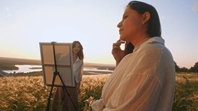 A young artist paints a portrait of a girl in a beautiful summer landscape, set against a backdrop of hills. - Powered by Shutterstock - Get 15% off with code: PIKWIZARD15