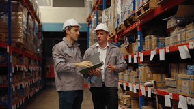 Warehouse workers are inspecting goods inside the warehouse.
 - Powered by Shutterstock - Get 15% off with code: PIKWIZARD15
