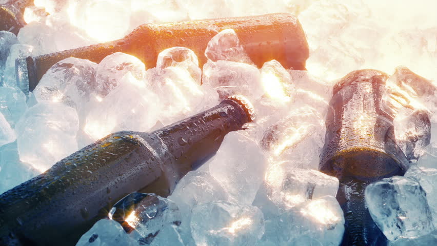Bottles Of Beer On Ice In Sun Glow