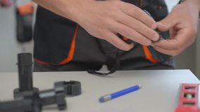 Man measuring furniture part during assembly kitchen cabinets, using measuring tape, tools and plastic furniture legs - Powered by Shutterstock - Get 15% off with code: PIKWIZARD15