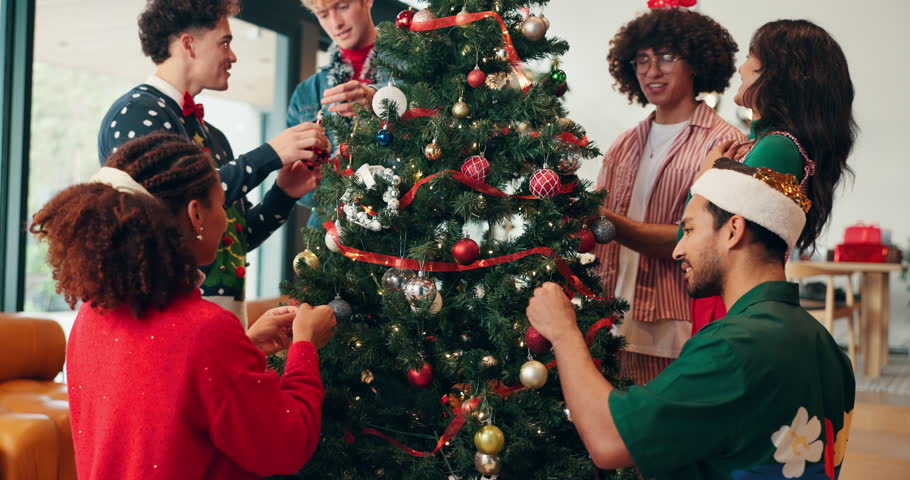 Christmas, tree and decoration with friends in home for festive season, celebration and party. Happiness, bonding and xmas holiday with people in living room for helping, ornament and support