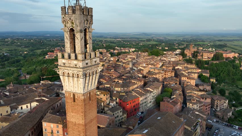 aerial view of Siena town in Tuscany, Italy, Torre del Mangia and Piazza del Campo in Siena, travel in Italian region of Tuscany. High quality 4k footage