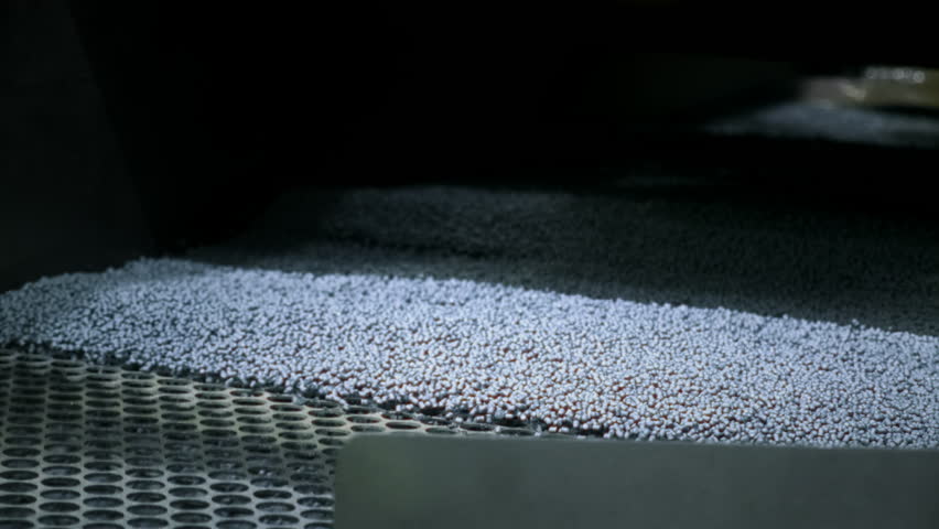 Extruder machine makes plastic granules, recycling polypropylene. Gray or white plastic pellets. Raw material for plastic or Polyethylene products. Garbage factory, waste plant. Recycling industry