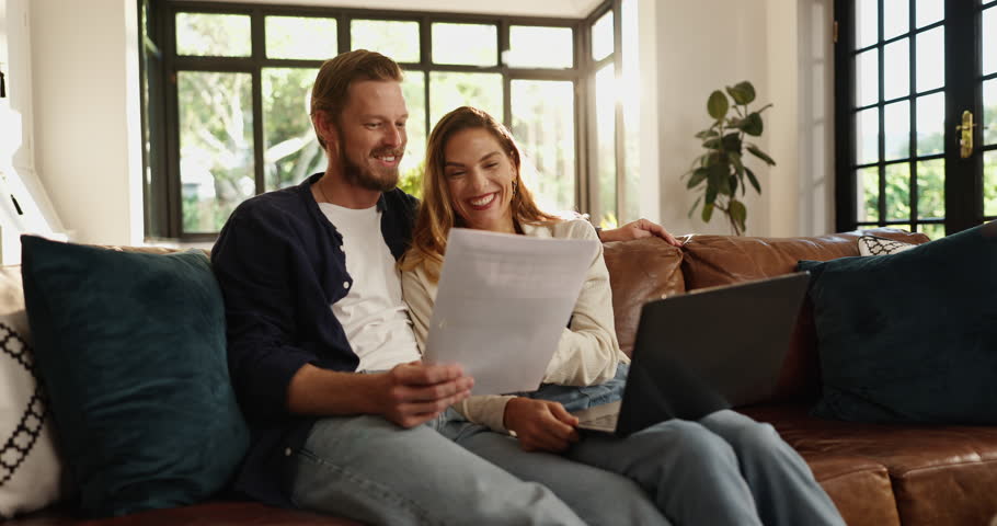 Paperwork, laptop and couple on sofa in home for planning budget, savings or investment account. Discussion, document and man with woman for finance report with computer for paying bills together.