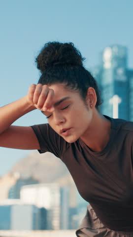 Sweating, break and woman for fitness, training and runner health for cardio or marathon in city. Rest, athlete and endurance challenge with energy in street for sports exercise, workout or wellness