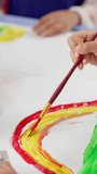 Painting, brush and hands of child in classroom at preschool for activity, hobby or cognitive development. Fun, student and closeup of kid with art for creative, poster or sign at elementary academy. - Powered by Shutterstock - Get 15% off with code: PIKWIZARD15