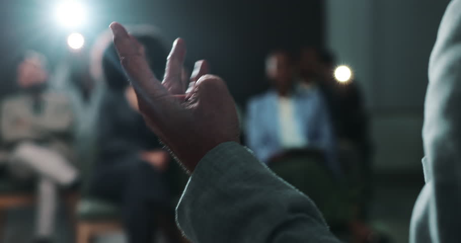 Public speaking, hand and person with motivation for crowd, politician or presentation for audience. Press conference, legislator and announcement on stage for official event, talking and podium