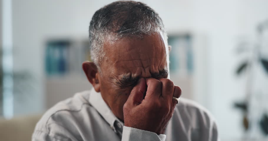 Healthcare, sad and old man in office, crying and emotion with cancer diagnosis. Pensioner, senior patient and tears with wellness, illness and disease with reaction, shocked and test results