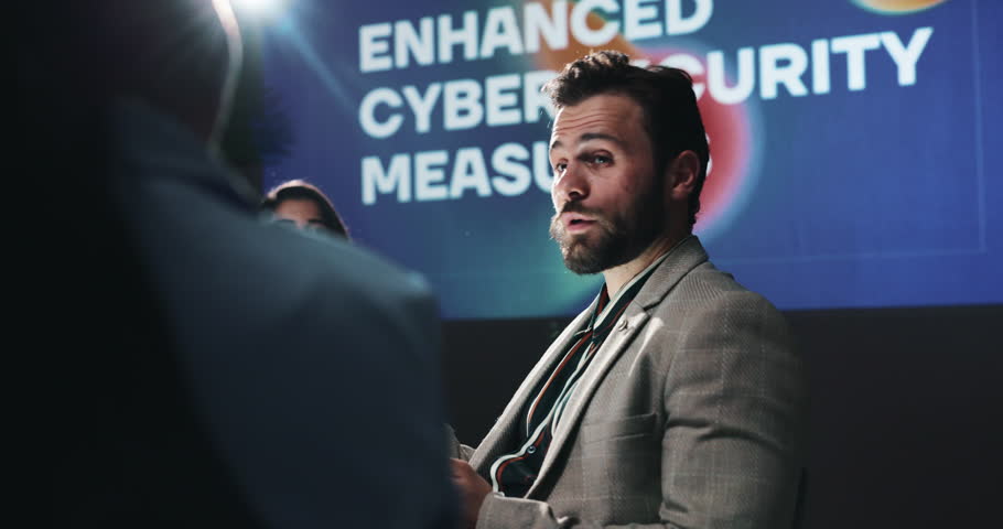 Tablet, group and business people in discussion in conference for enhanced cybersecurity measures. Seminar, digital technology and team of malware analysts with planning for website encryption system