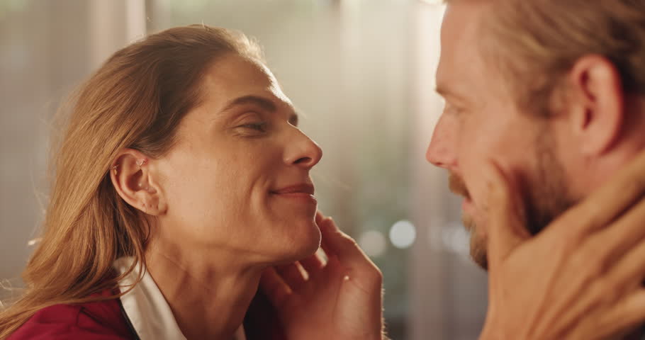 Happy, couple and touch with love at house for romance, affection and connection of relationship. Smile, people and passion with partner for special moment, bonding together and marriage commitment
