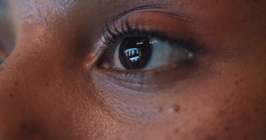 Reading, closeup and eyes of person in office on computer for research, online project and article. Face, editor and worker with reflection for digital magazine review, proofreading and information
