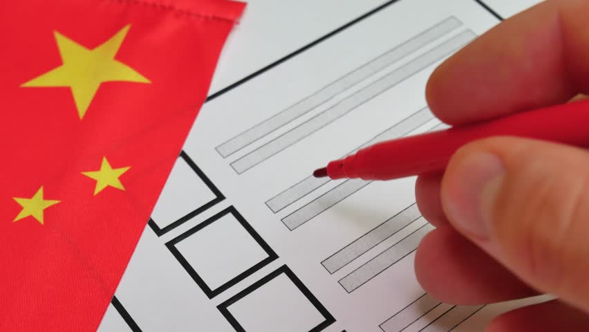 Voter uses red marker to mark candidate on paper ballot. Democratic elections in People Republic of China. Red flag with yellow stars in background. Electoral process, political decision making