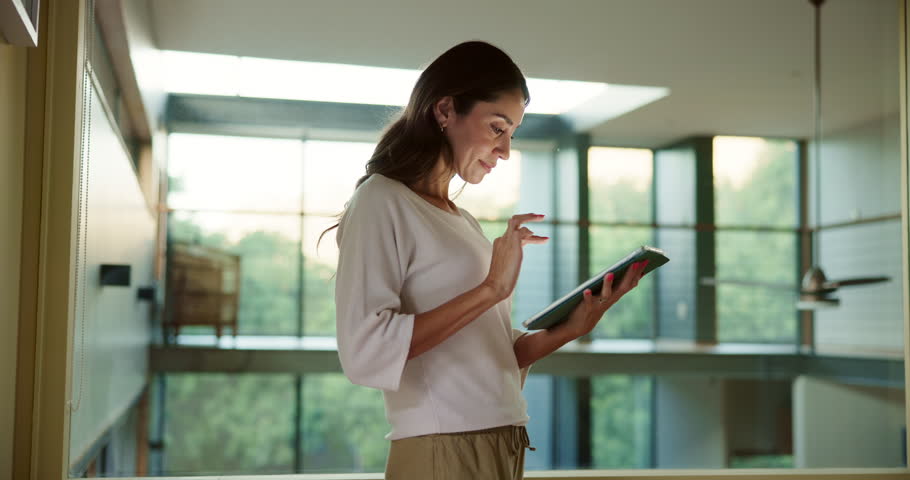 Smart home, system or woman with tablet for lights, innovation or control panel. Software app, house automation or female person with touchscreen technology for electronic appliances or modern remote