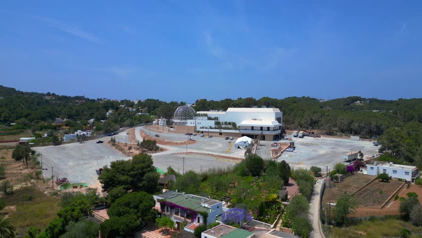 Ibiza club with geodesic dome, parking area. Fantastic aerial view flight drone