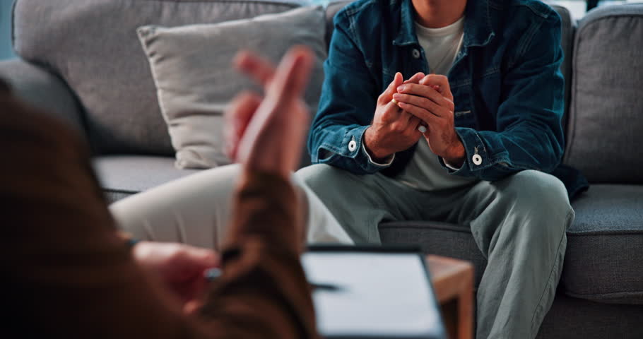 Person, anxiety and therapist talking for counseling of assessment, trauma and mental health tips. Patient, consultation and advice from psychologist, evaluation and information of medical treatment