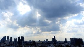 Urban Skyline Under Dramatic Cloudy Sky with Sunbeams - Powered by Shutterstock - Get 15% off with code: PIKWIZARD15
