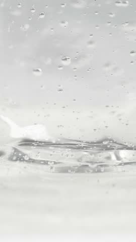 Cosmetics serum gel background, transparent cream texture, facial mask treatment