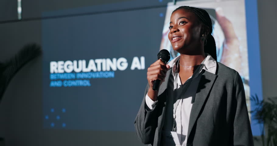 Black woman, seminar and speaker with microphone at event for regulating AI pros and cons. Female leader, convention or conference by screen for learning about risk management for future of tech
