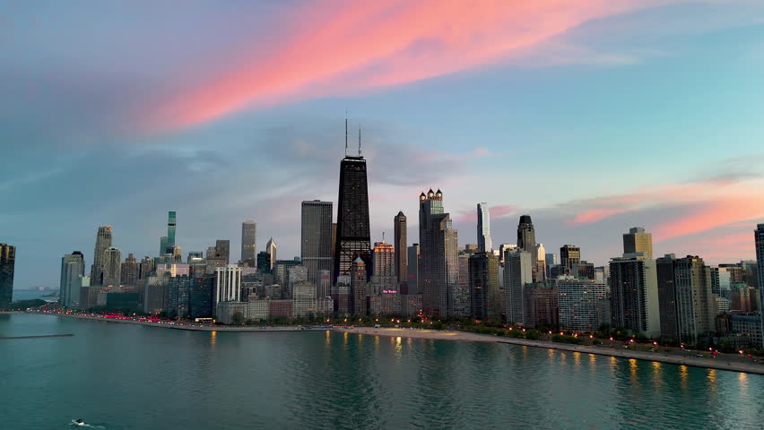 Aerial view rotating in front of Streeterville, colorful evening in Chicago