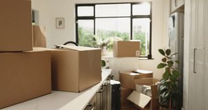 Moving, boxes and kitchen of new house, real estate and property with furniture, investment or loan. Empty, home and cardboard for relocation in apartment, mortgage and unpacking of packages in room - Powered by Shutterstock - Get 15% off with code: PIKWIZARD15