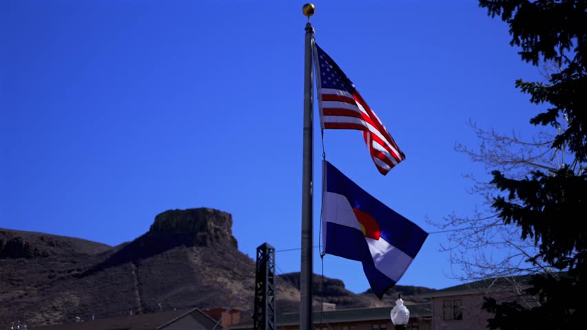 Colorado USA Flag Golden Colorado aerial drone street view North Table Mountain Mesa Golden Gate Canyon winter sunny morning afternoon blue sky wind street view Clear Creek static shot