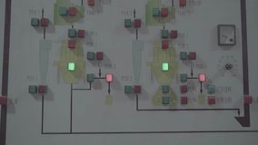 Industrial switch control panel high-tech factory automation with electrical diagrams and touchscreen controls with green and red indicator lights - Powered by Shutterstock - Get 15% off with code: PIKWIZARD15