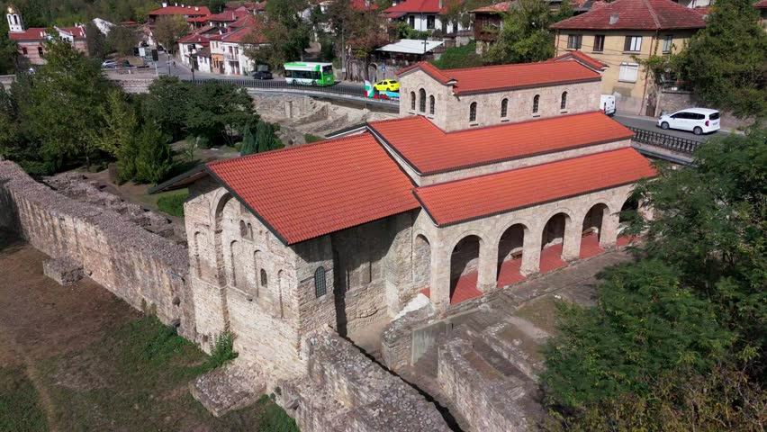 Drone circling Holy Forty Martyrs Church from right to left, showcasing medieval architecture and roof tiles.