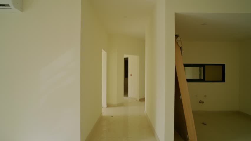 Bright and clean interior passage with doorways in a modern residential property. POV Walk Through