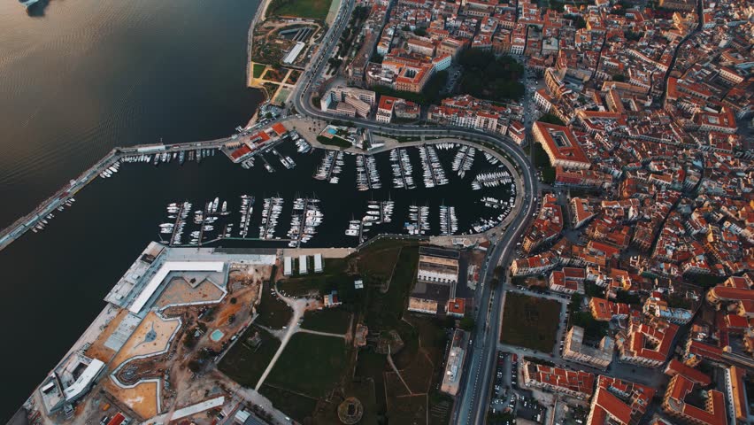 Palermo harbor and old town, captured from above during warm Sicilian evening. Aerial drone top view