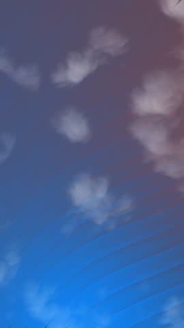 Vertical Abstract motion background with clouds and blue gradient lines creating a dynamic and evolving backdrop element.
