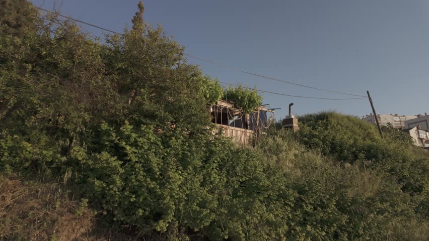 Beautiful low angle view of a seaside house among trees on a sunny day