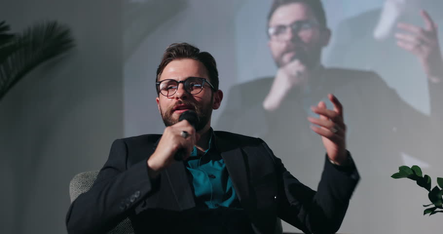 Stage, speaker or man in event speech for global economy, forum or finance resources. Presentation, education and keynote guest on mic to talk for financial growth, inflation solution or convention