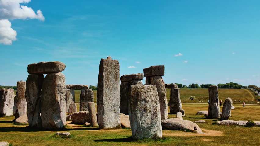 Weathered upright stones and horizontal lintels silhouette against the vast horizon on Salisbury Plain, Stonehenge, Salisbury, Wiltshire, England, UK

