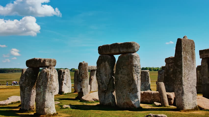 Weathered upright stones and horizontal lintels silhouette against the vast horizon on Salisbury Plain, Stonehenge, Salisbury, Wiltshire, England, UK
