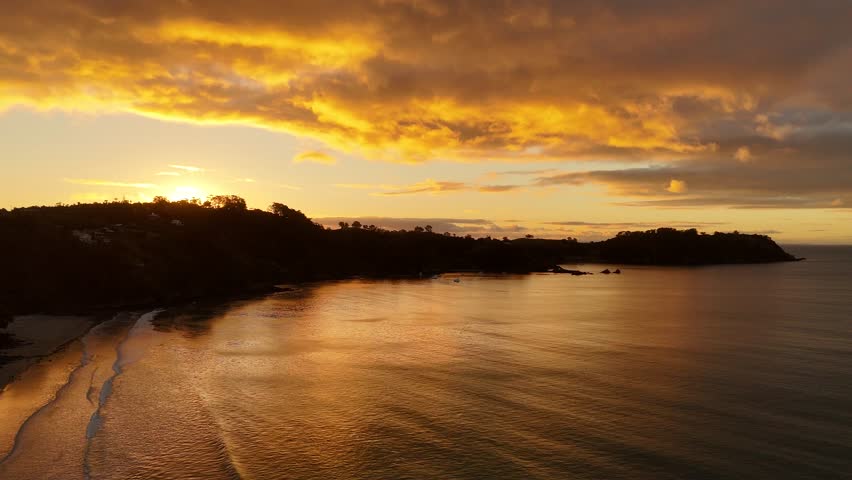 Aerial view during golden hour over Onetangi Beach, Waiheke island, New Zealand.