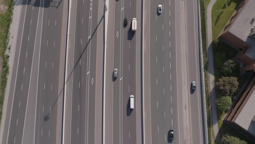 Wide aerial view of Highway 401 in Mississauga, showcasing vehicles on the road
