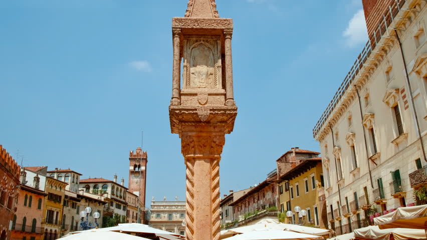Vibrant market square surrounded by ornate facades, decorative fountains and bustling stalls, Piazza delle Erbe, Verona, Veneto, Italy
