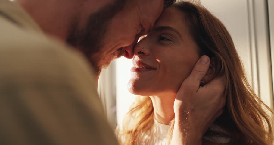 Happy, love and couple in home for connection, affection and bonding together with marriage. Smile, safety and man with woman for romance in relationship on weekend break with care in house.