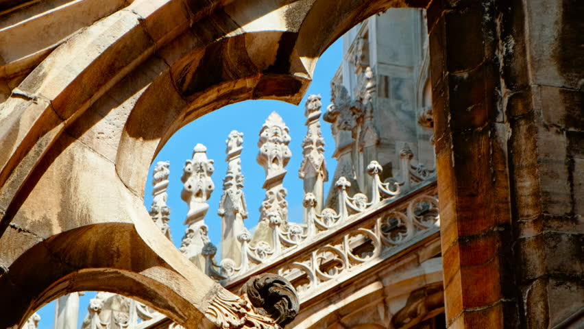 Overhead shot revealing the intricate spires, ornate rooftop sculptures and flying buttresses crowning the Duomo di Milano, Duomo di Milano From Above, Milan, Lombardy, Italy

