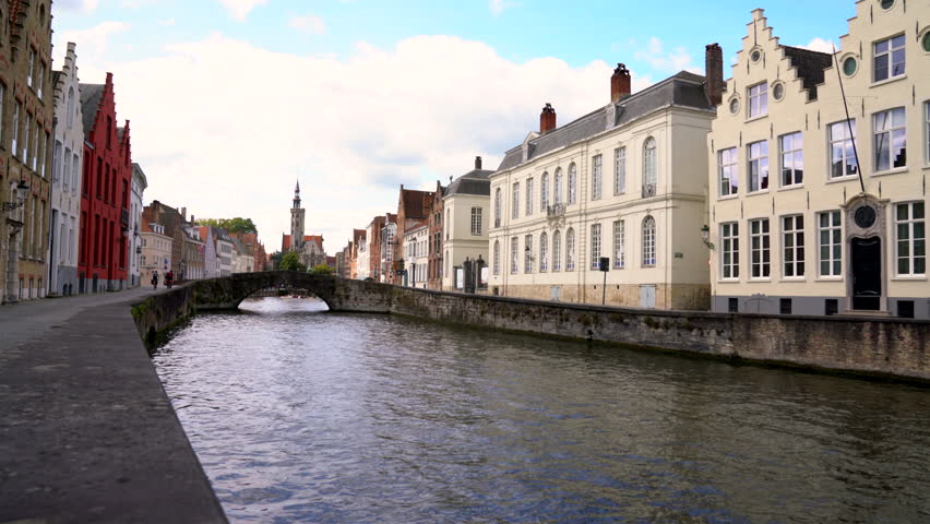Historic Buildings Line the Spiegelrei Canal Bruges Belgium 4K UHD. Historic buildings on both sides of the Spiegelrei canal near Jan Van Eyck Square. Bruges, Belgium 4K, UHD.
